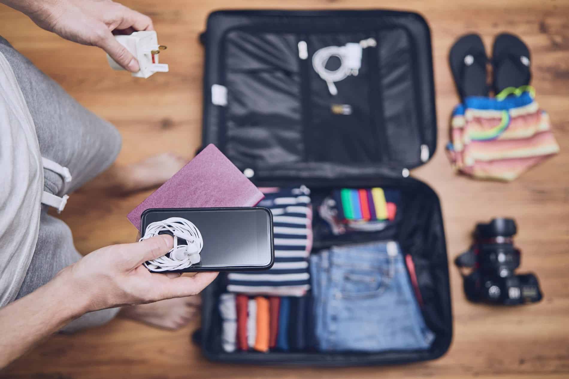 Packing a suitcase with travel gadgets